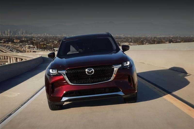 Red Mazda CX-90 on the highway