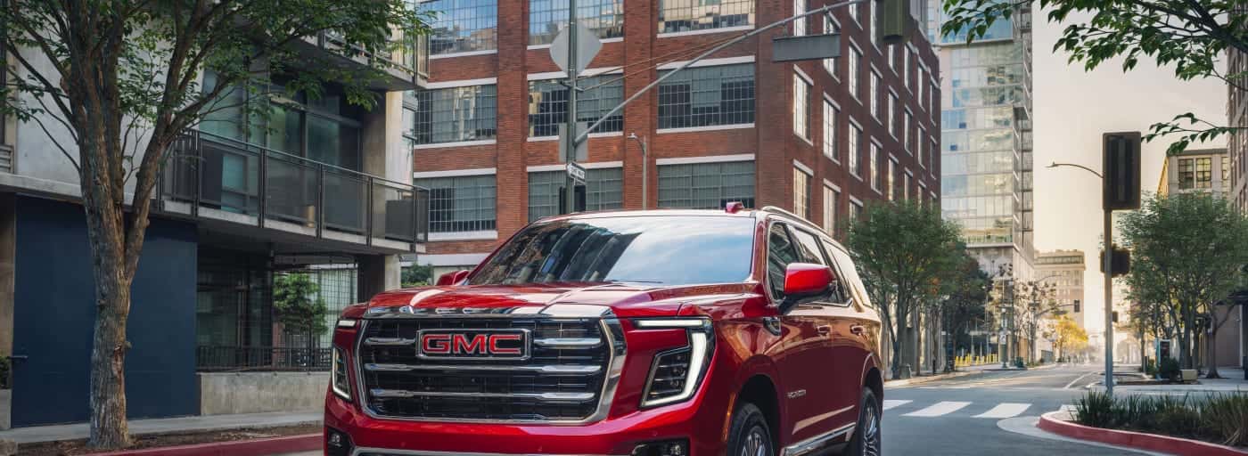 A red GMC Yukon XL in City