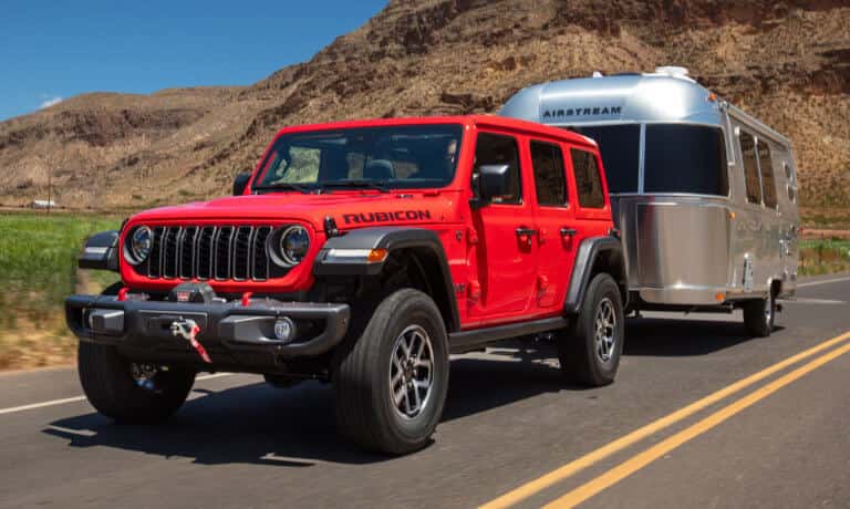 2026 Jeep Wrangler towing a camper