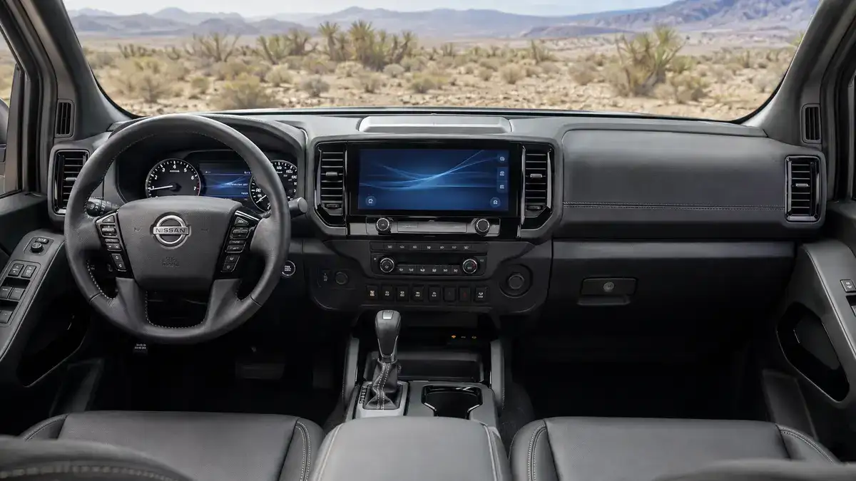 Nissan Frontier interior showing the dashboard, centre touchscreen, gauge cluster and centre console