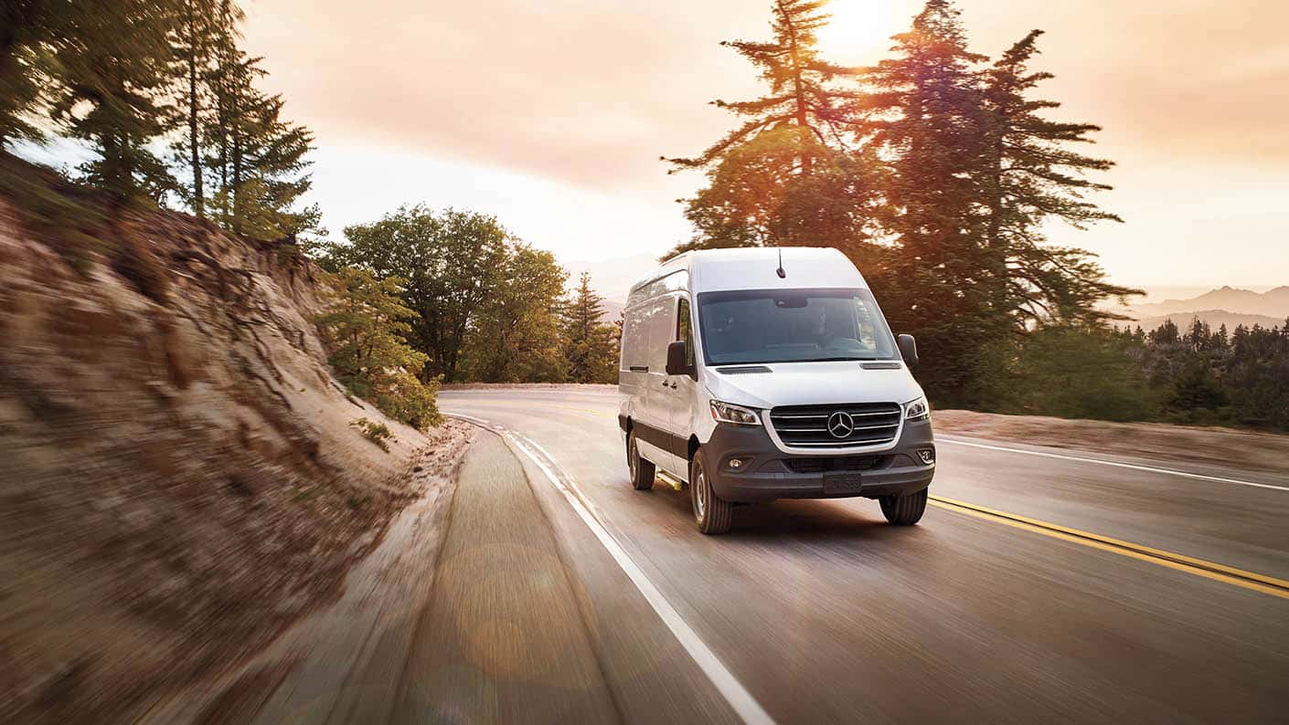Mercedes-Benz Sprinter Cargo Van traveling on a curved roadway