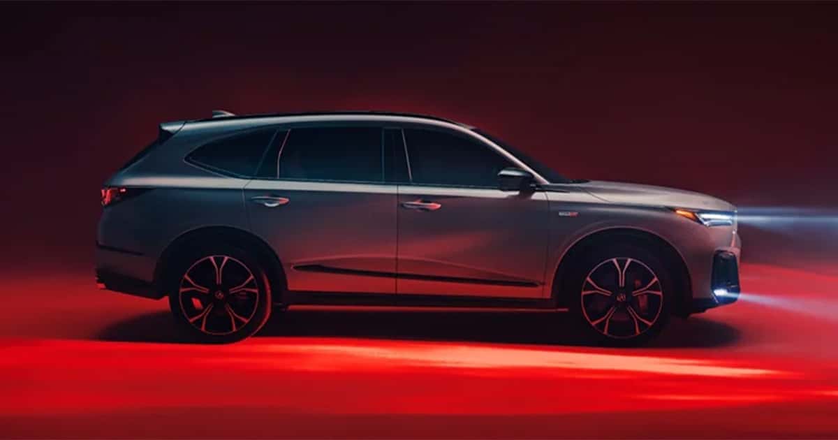 A silver Acura MDX parked on display.