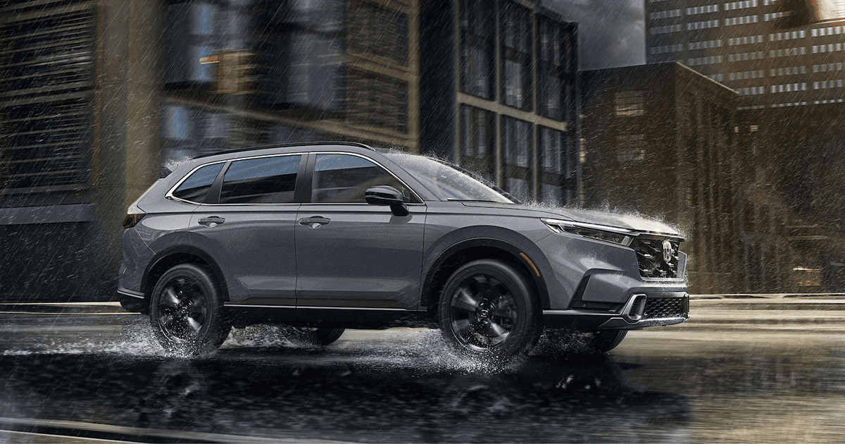 Honda SUV driving in rain