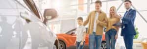 family at car dealership