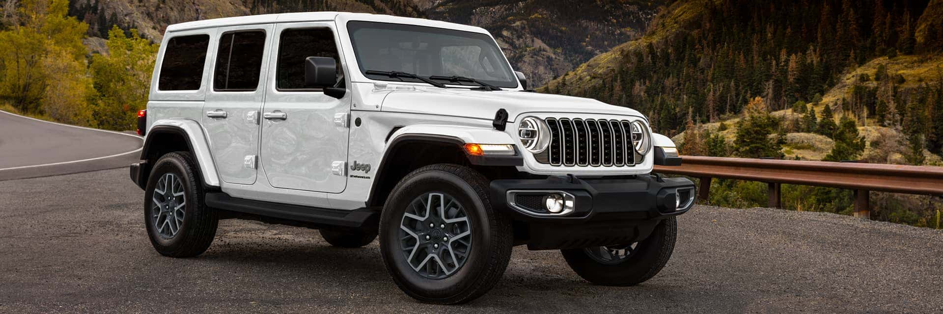 2026 Jeep® Wrangler parked in front of mountains