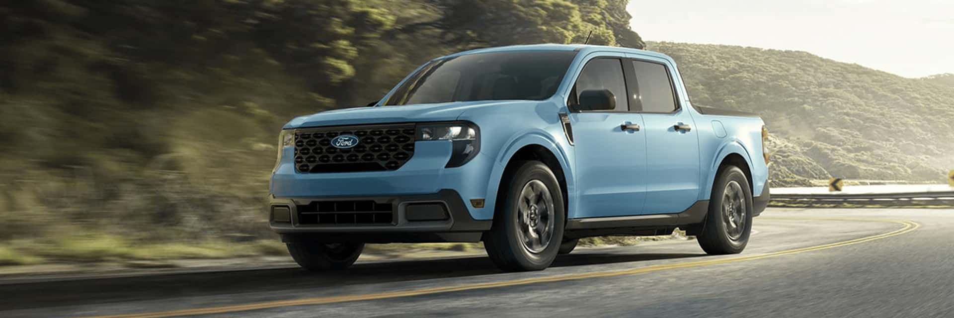 blue 2026 ford maverick driving