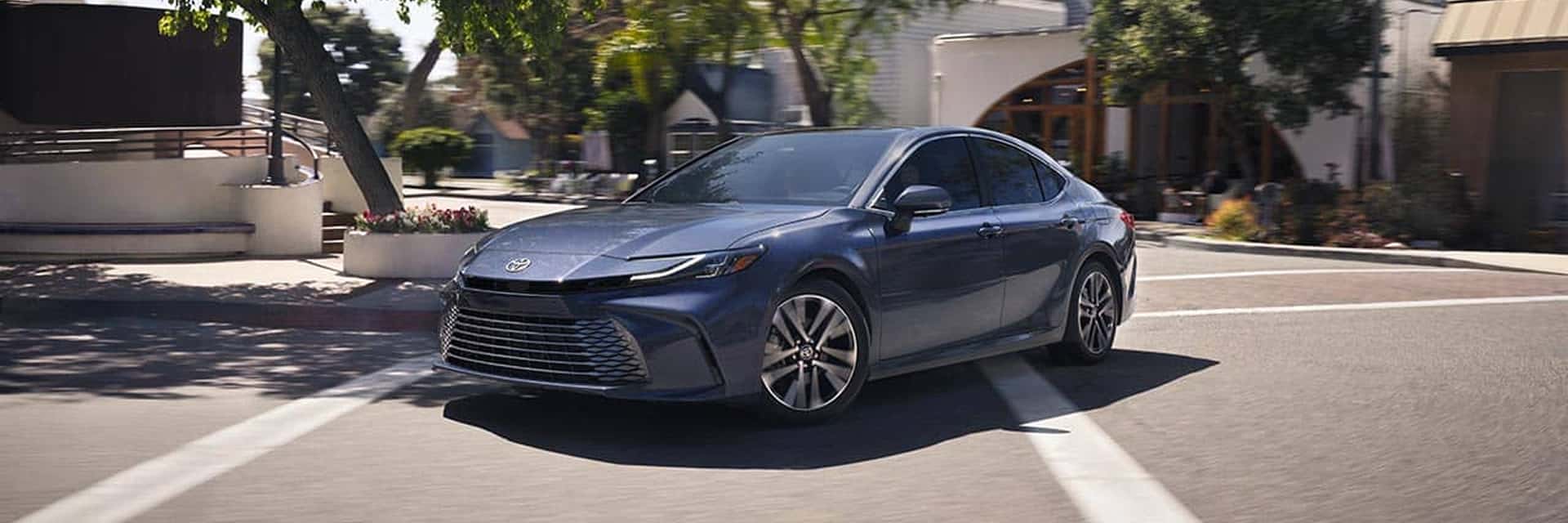 blue toyota camry in parking lot