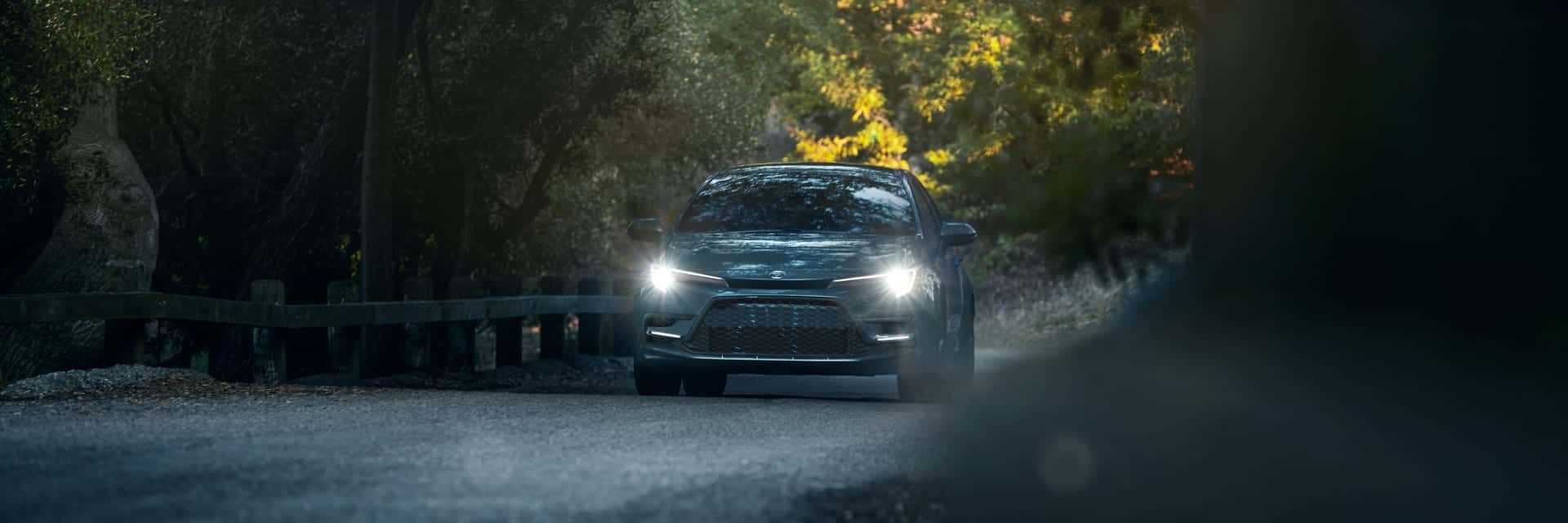 grey 2026 Toyota Corolla driving