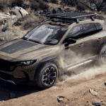 2026 Mazda CX-50 Hybrid driving in the dirt