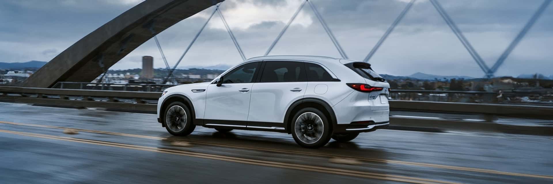 2026 mazda cx-90 driving on road