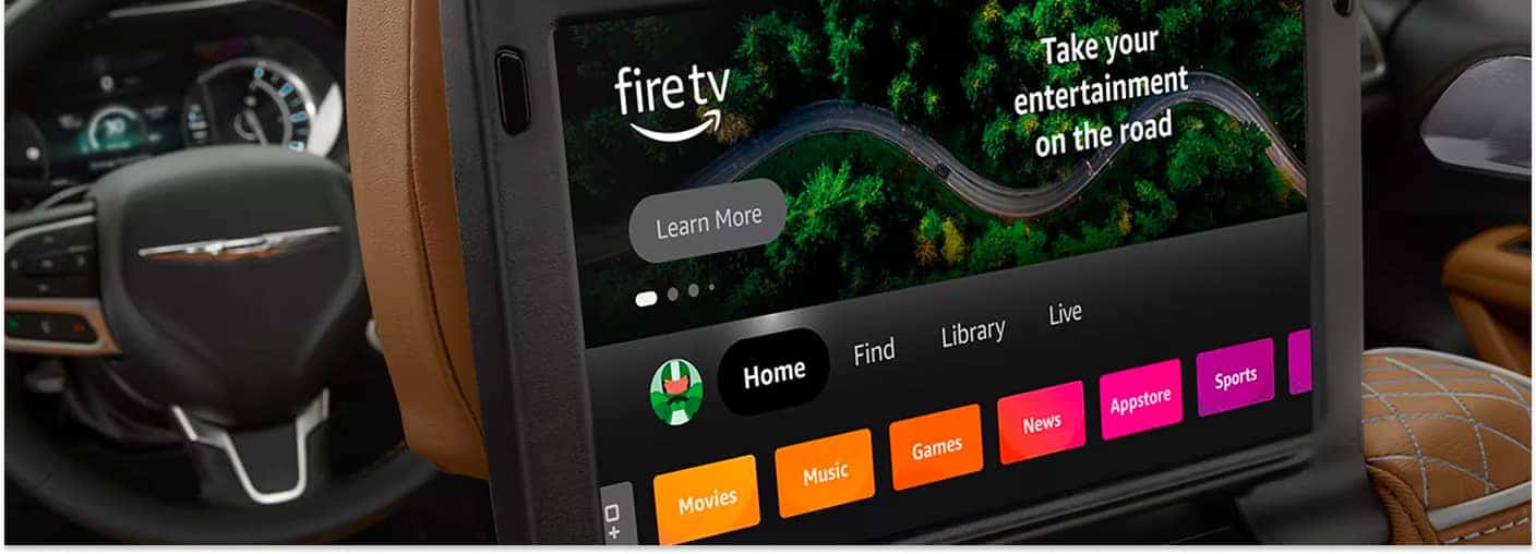 2026 Chrysler Pacifica rear seatback screen displaying Amazon Fire TV interface with tan leather interior.