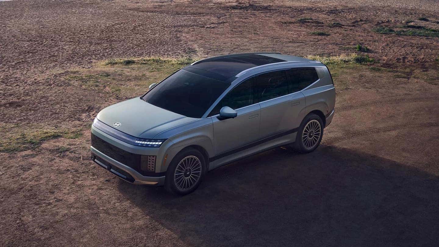 A light blue Hyundai IONIQ 9 driving off-road