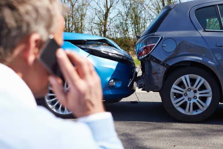 Man on phone after accident
