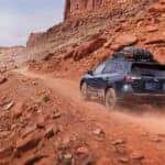 2025 Subaru Outback driving off road in the desert.