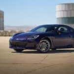 A blue Subaru BRZ sitting on the runnway.