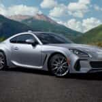 2025 Silver BRZ parked on a hill with the mountains in the background.