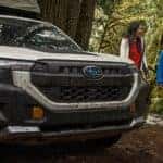 Camping with a white Subaru Forester.
