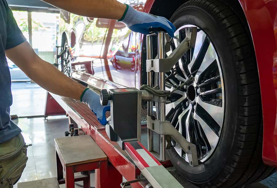Wheel Alignment ,grid Sensor Sets Mechanic On Auto. Car Stand Wi