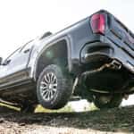 A black 2025 GMC Sierra 1500 AT4 from a low angle.