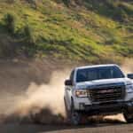 A white 2022 GMC Canyon AT4 from the front.