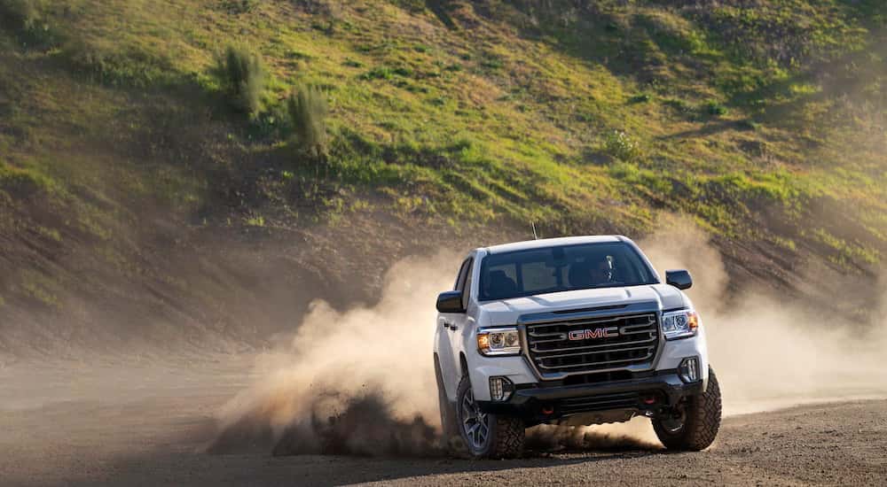 A white 2022 GMC Canyon AT4 from the front.
