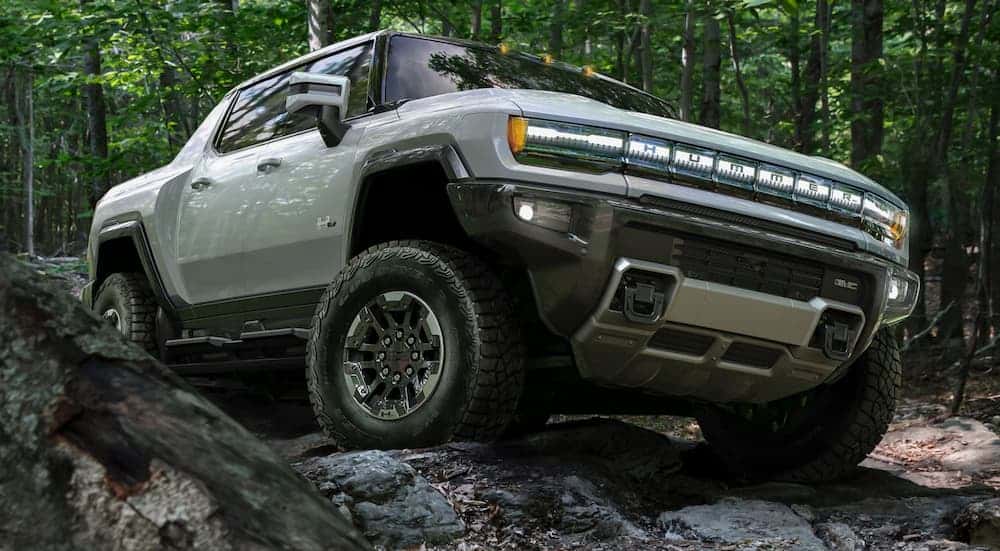 A white 2022 GMC Hummer EV from the front at an angle.