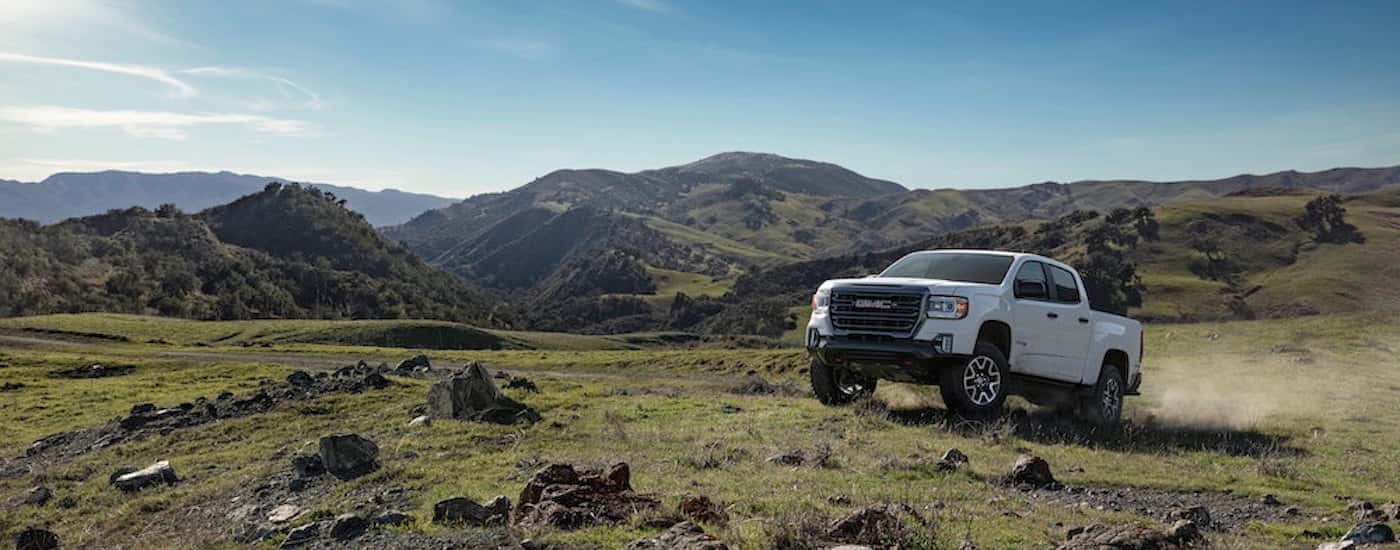 A white 2022 GMC Canyon from the front at an angle.