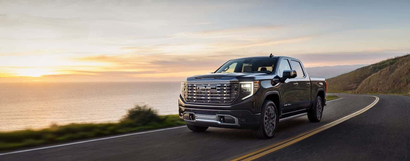 A grey 2024 GMC Sierra 1500 from the front at an angle.