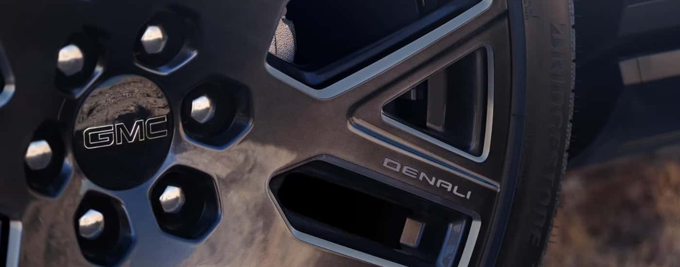 Black wheel on a 2025 GMC Yukon for sale.