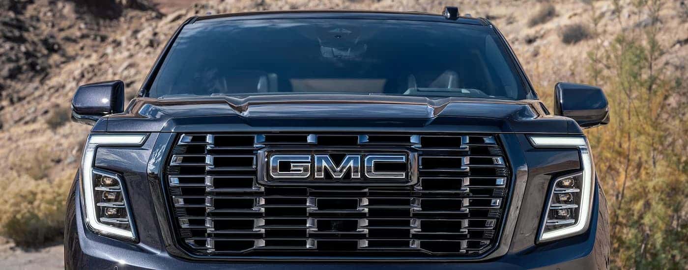 Front grille of a black GMC Yukon Denali from a GMC dealer near Red Bank