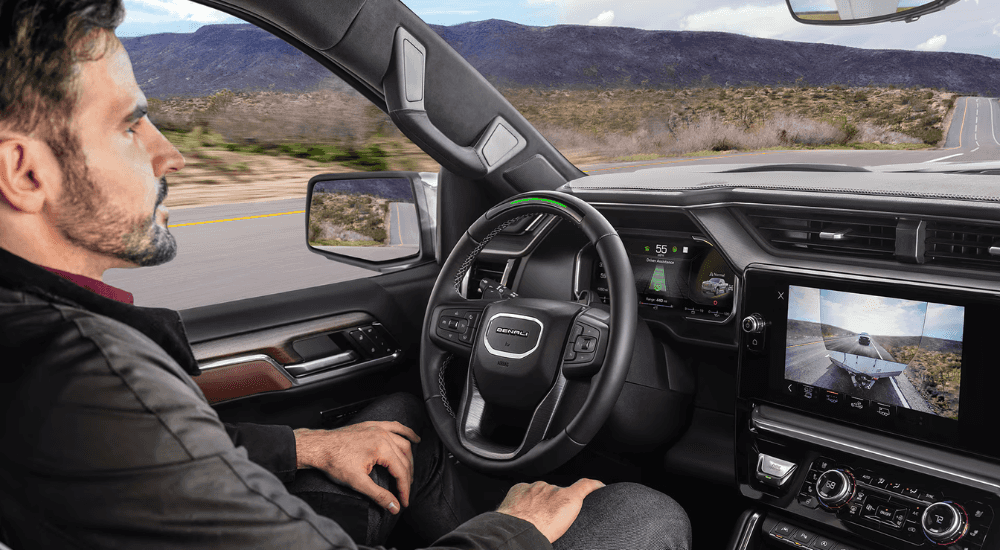 A person uses the Super Cruise feature on their 2026 GMC Sierra Denali 1500