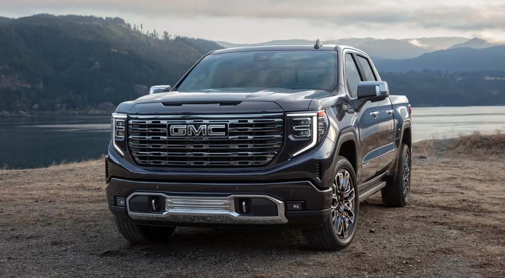 Black 2026 GMC Sierra 1500 Denali Ultimate parked near a lake