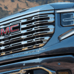 Chrome grille of a blue 2026 GMC Sierra 1500
