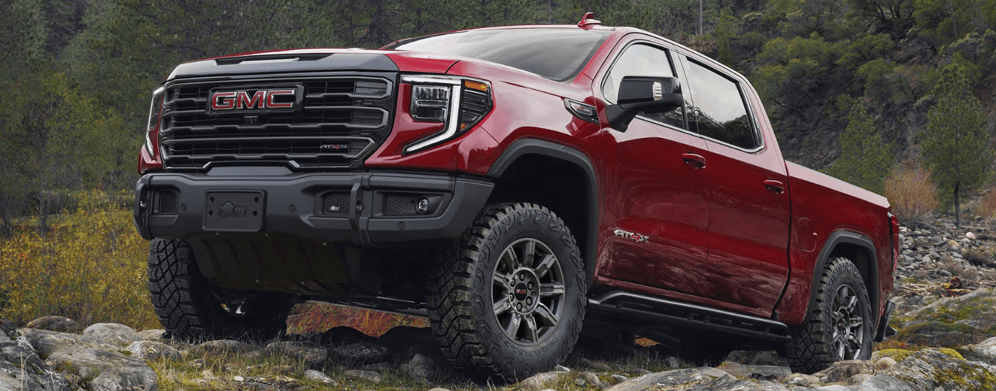Red 2026 GMC Sierra 1500 AT4X parked at an angle