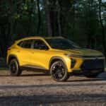 A yellow 2024 Chevy Trax from the front after leaving a used Chevy dealer.