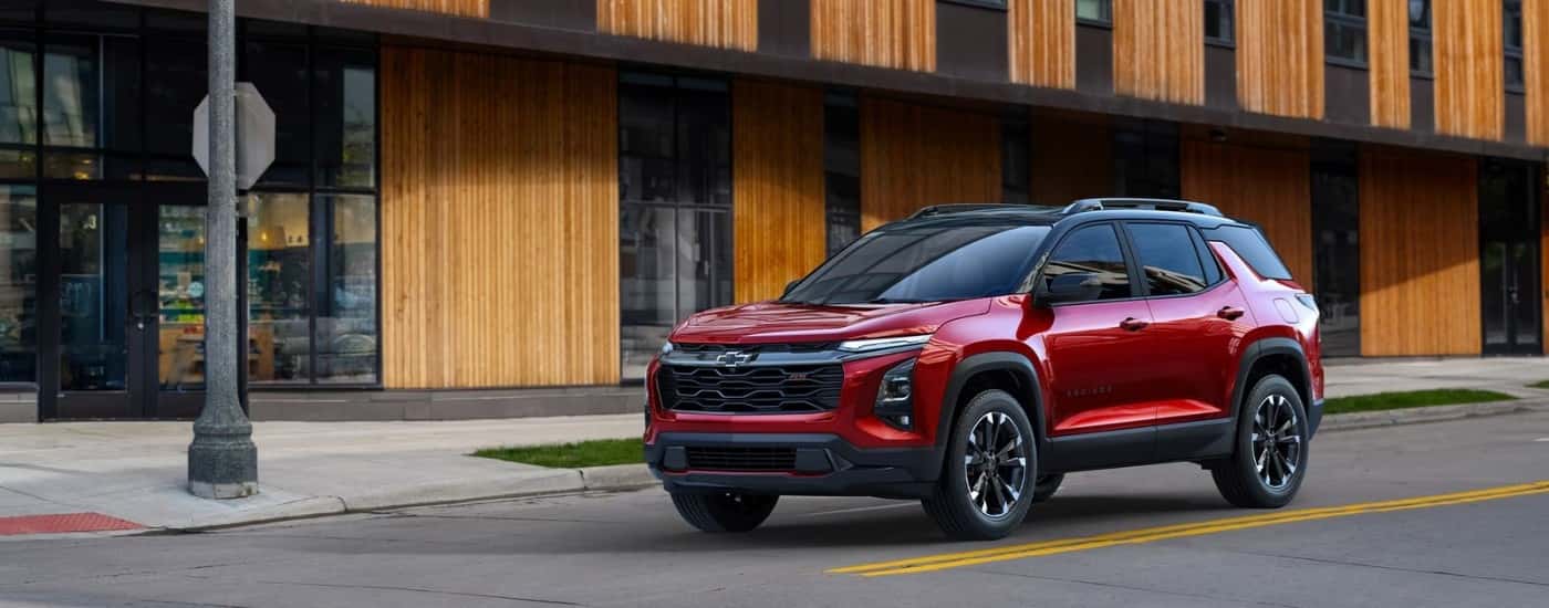 A red 2025 Chevy Equinox for sale from the front at an angle.