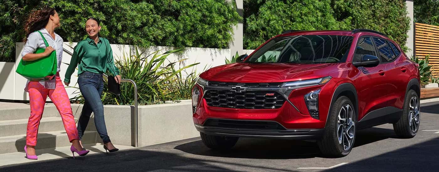 Red 2024 Chevy Trax RS parked by a curb.