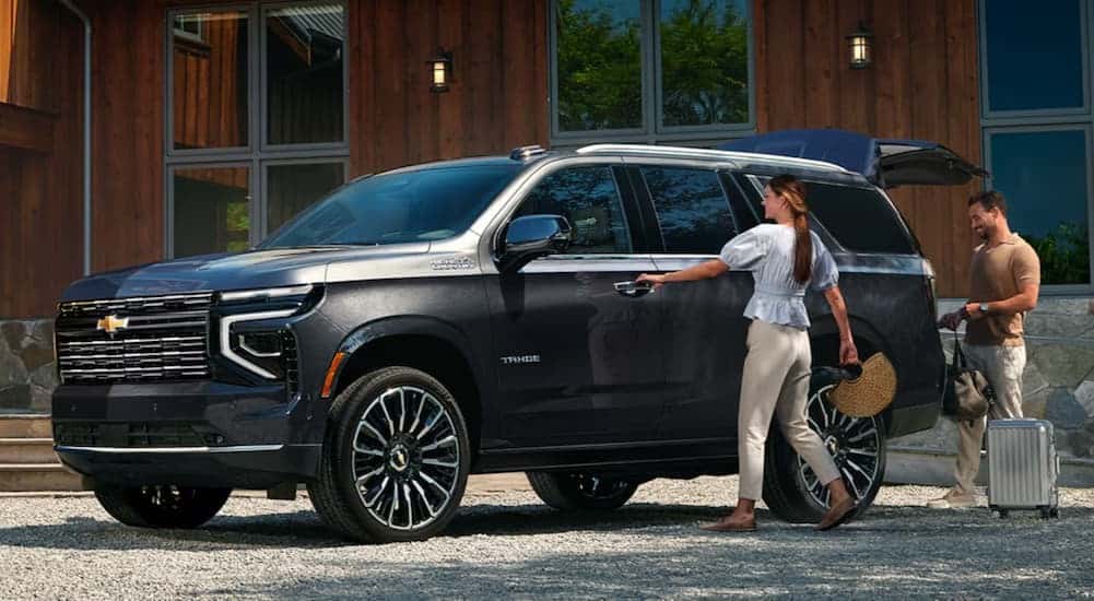 A gray 2026 Chevy Tahoe for sale parked on a driveway.