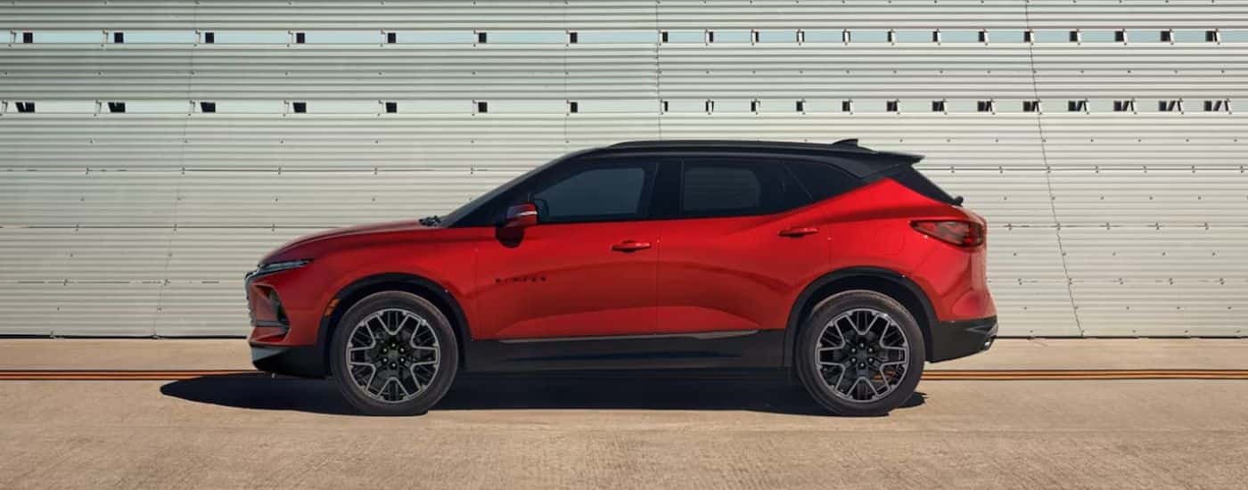 Red 2023 Chevy Blazer parked against a wall