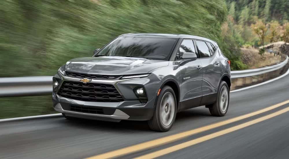 Grey 2026 Chevy Blazer for sale driving on a highway