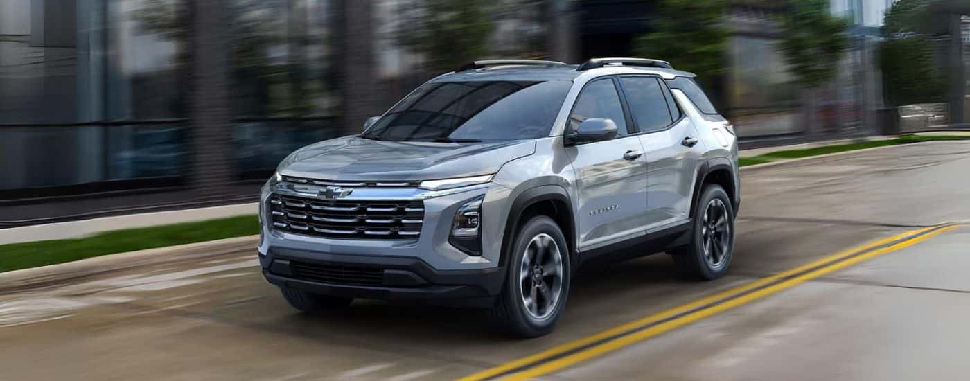 Silver 2025 Chevy Equinox driving on a open road