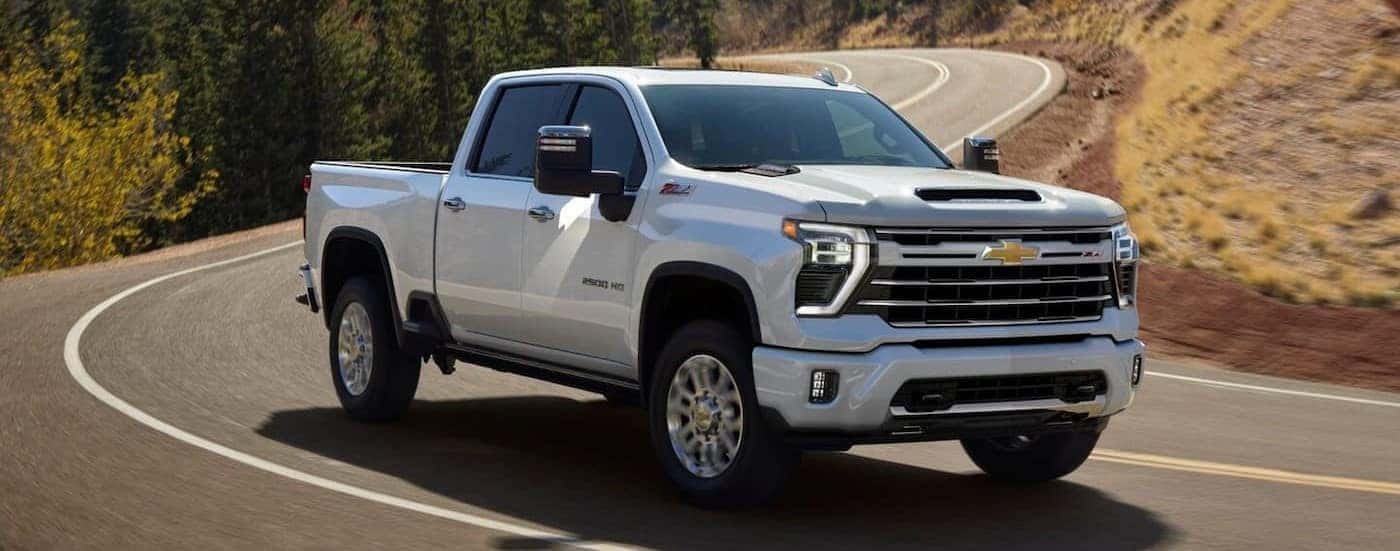 White 2026 Chevy Silverado 2500 HD Z71 on a winding road