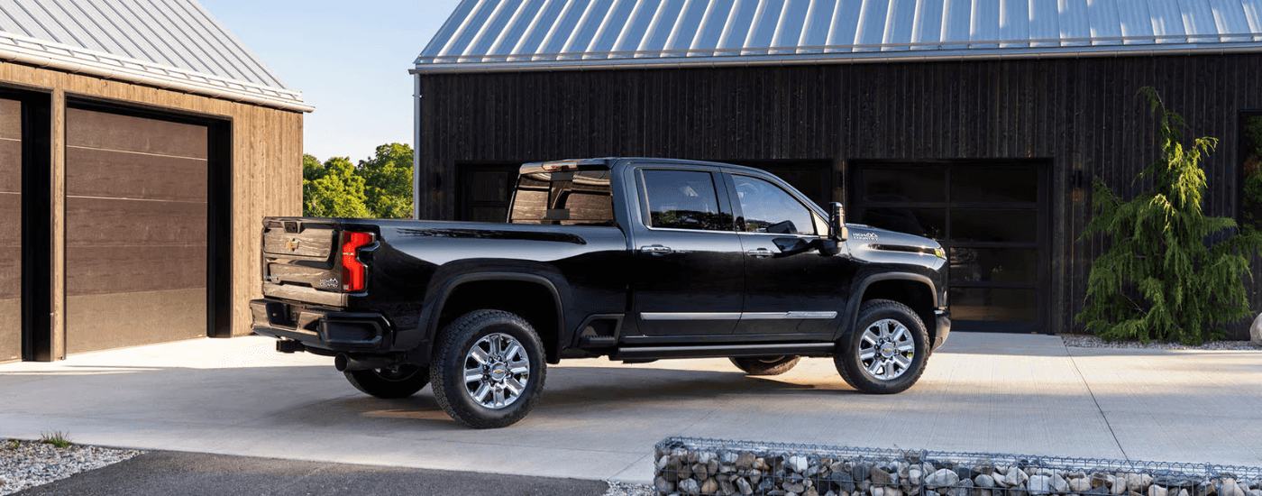 Black 2026 Chevy Silverado 2500 HD parked in a driveway