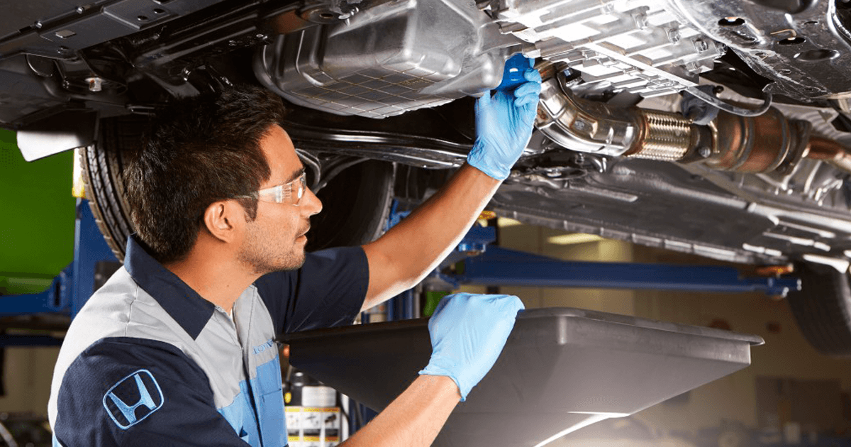 Honda tech working on vehicle
