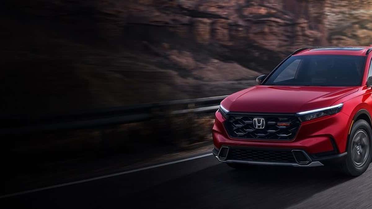 2026 Honda CR-V TrailSport Hybrid front three-quarter view in Radiant Red Metallic