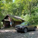 Hyundai Santa Fe near House in Forest
