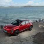 Electric Red Hyundai Kona on Seashore