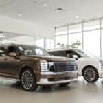 Two Hyundai Palisades in the Huffines Hyundai McKinney Showroom