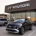A black Hyundai Tucson in front of Huffines Hyundai in McKinney, TX