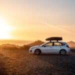 a 2023 subaru impreza overlooking the sunset